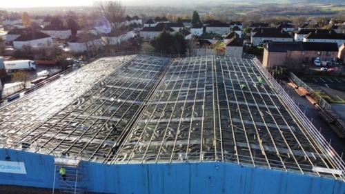 Preparing an industrial asbestos roof overlay